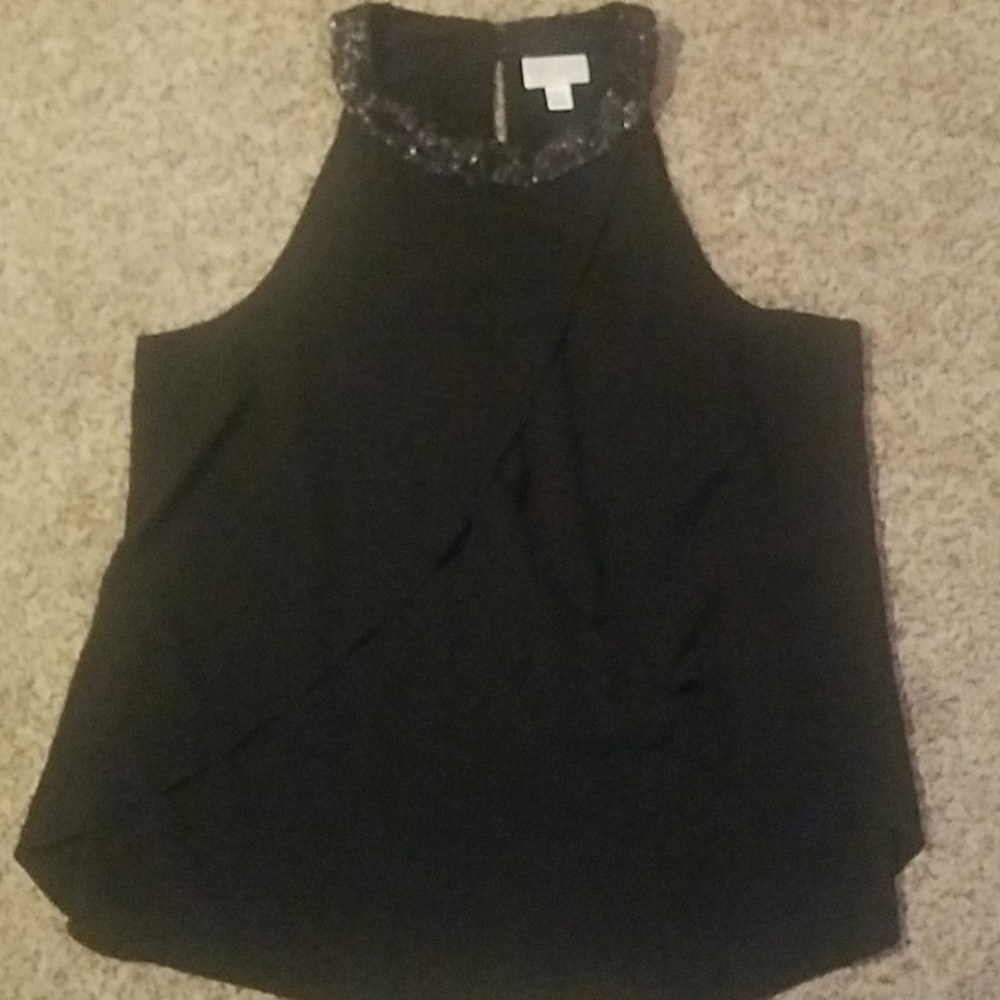 Sleeveless black shirt with sequins